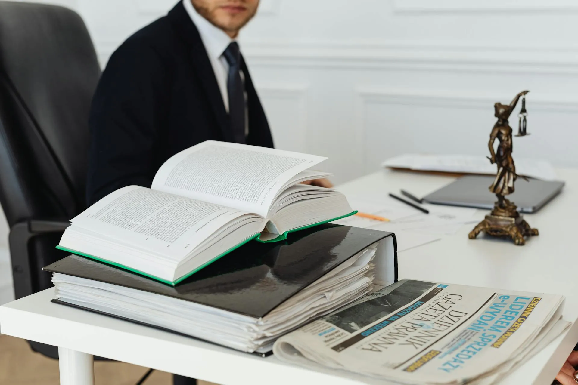 Legal books and binder on a desk representing professional law firm services