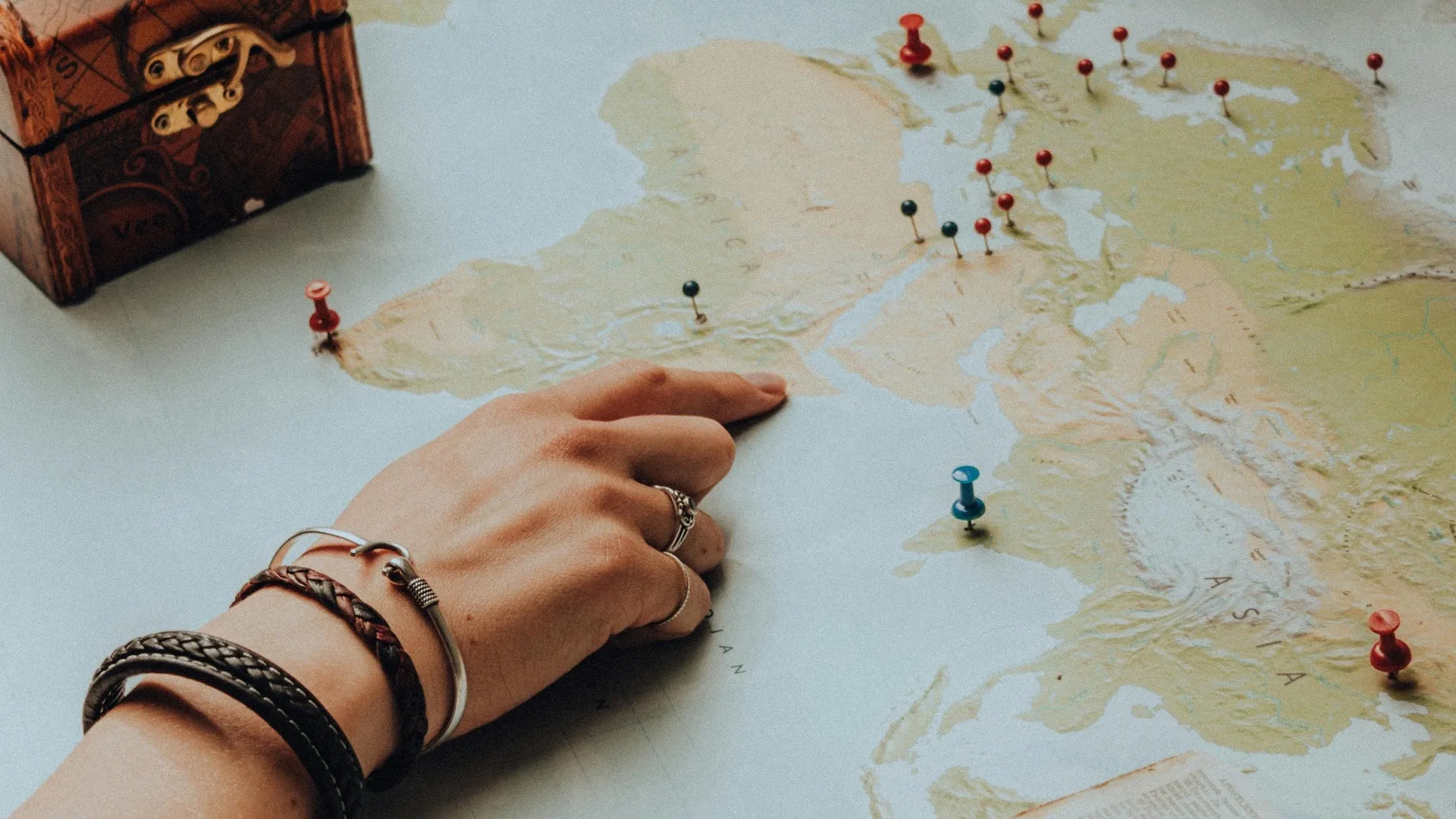 World map with pins marking global business locations — representing our worldwide client reach